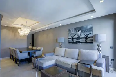 a living room and dining room with a couch and a table at W-Aldorf in Casablanca