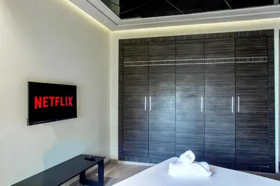 a bedroom with a large sliding closet door at Top flat at central Massira Maarif in Casablanca