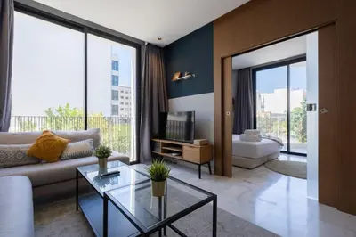 a living room with a couch and a tv at super appartement with parking c4 in Casablanca