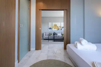 a room with a bed and a living room at super appartement with parking c4 in Casablanca