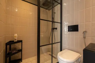 a bathroom with a shower and a toilet at super appartement with parking c4 in Casablanca