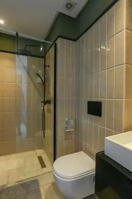 a bathroom with a shower and a toilet and a sink at Amazing view Fast WiF with Gym near tramway in Casablanca
