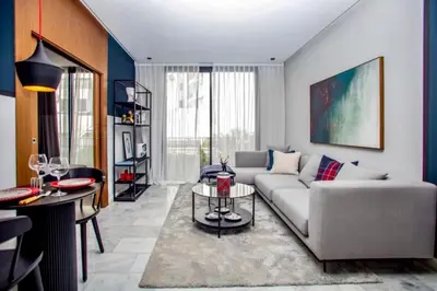 a living room with a couch and a table at Upscale flat with Gym in Casablanca