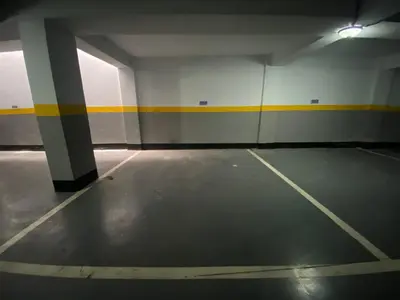 an empty parking garage with a yellow stripe on the wall at CORNICHE CASABLANCA - VINTAGE F2 NEUF in Casablanca