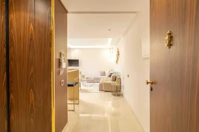 a hallway with a room with a bed and a door at Luxury one bedroom in Maarif one in Casablanca