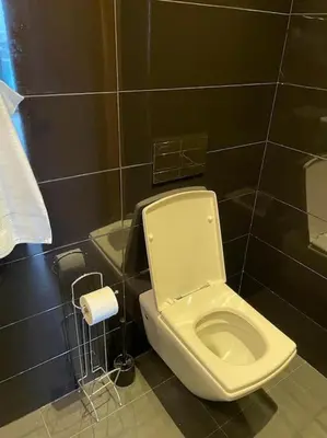 a bathroom with a toilet and a roll of toilet paper at Superb Apartment on 14th floor with Jacuzzi in Casablanca
