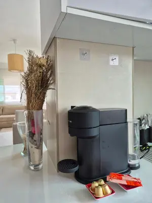 a coffee maker on a counter with a plate of food at My Cosy Place Rabat - Cosy Home Wifak Temara in Temara