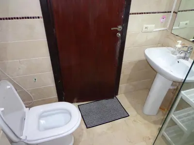 a bathroom with a toilet and a sink at Zen Home in Casablanca