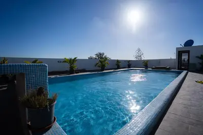 a swimming pool on the roof of a building at Chez Betty in Casablanca