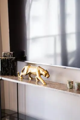 a figurine of a dog sitting on a shelf at Metropolitan 06-Two Bedrooms - Cavalli Luxury Flat in Casablanca