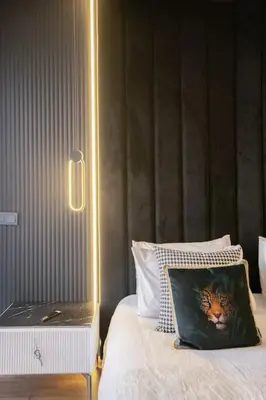 a bedroom with a bed with a cat pillow on it at Metropolitan 06-Two Bedrooms - Cavalli Luxury Flat in Casablanca