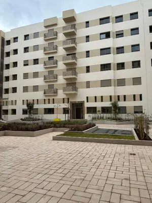 a building with a courtyard in front of it at TAJ NOUACEUR AéROPORT MOHAMMED V in Nouaceur