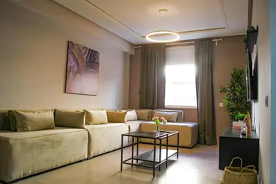 a living room with a couch and a table at YourPlace - 2BR - Agdal - Av France in Rabat