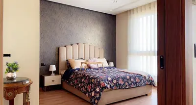 a bedroom with a large bed and a window at Studio de luxe à casa finance city in Casablanca
