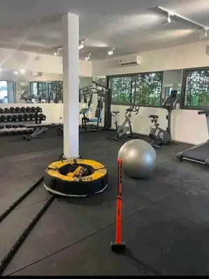 a fitness room with a gym with a pole and weights at Studio de luxe à casa finance city in Casablanca