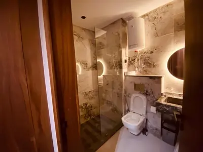 a bathroom with a toilet and a sink at Appartement Cosy et chaleureux - Casablanca centre in Casablanca