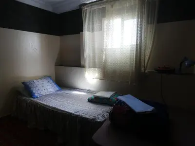 a small bed in a room with a window at Booking and hosting medina in Casablanca