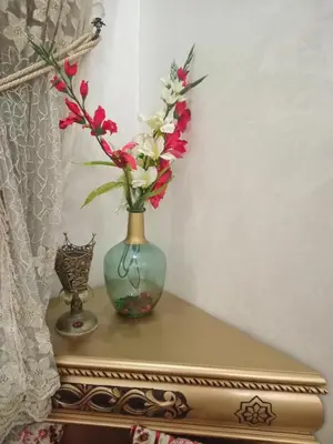 a vase with flowers in it sitting on a table at 3 Bedroom Apartment with Wifi in Casablanca