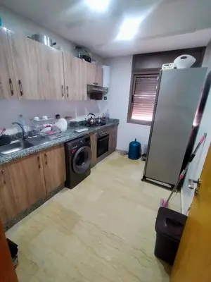 a kitchen with a stainless steel refrigerator and a dishwasher at 3 Bedroom Apartment with Wifi in Casablanca