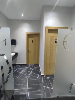 a room with two doors and a tile floor at LOTUS HOTEL Casanearshore in Casablanca