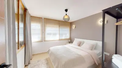 a bedroom with a white bed and a window at My Cosy Place Rabat - Studio Agdal 50m Arribat Center in Rabat