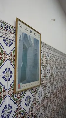 a mirror on the wall of a room with tiles at Auberges Des Jeunes Casablanca in Casablanca