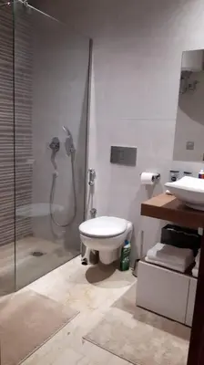 a bathroom with a shower and a toilet and a sink at Chez Miguel Casablanca in Casablanca