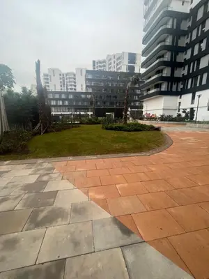 a courtyard in a city with tall buildings at Luxurious Appartement at Casa Finance City in Casablanca