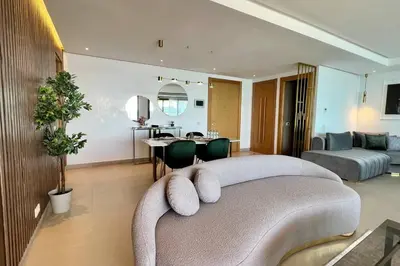 a bedroom with a couch and a living room at Casablanca Marina Ocean View - By AppartAli in Casablanca