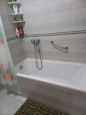 a white bath tub in a bathroom with a shower at STAR APPARTEMENT GAUTHIER in Casablanca