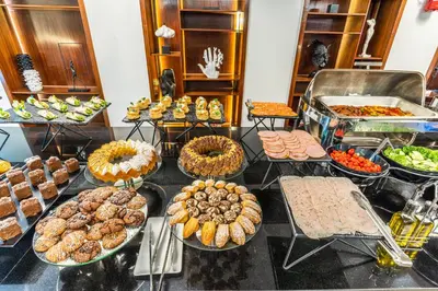 a buffet filled with lots of different types of food at One Hotel Casablanca in Casablanca