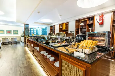 a buffet line with food on it in a restaurant at One Hotel Casablanca in Casablanca