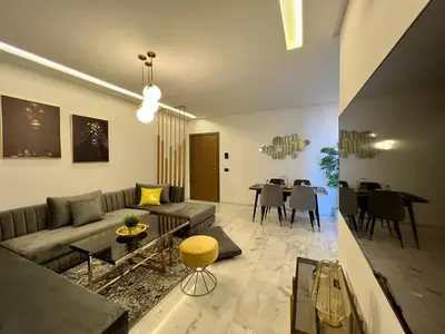 a living room with a couch and a table at Anfa 212 Top Floor - 2 Bedrooms- By AppartAli in Casablanca
