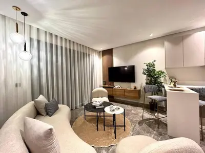 a living room with a couch and a table at Presidential Suite City Center by AppartAli in Casablanca