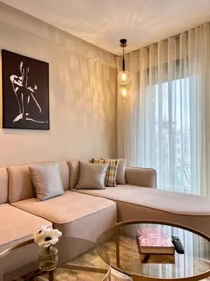 a living room with a couch and a glass table at Centro 2 Bedrooms- By AppartAli in Casablanca