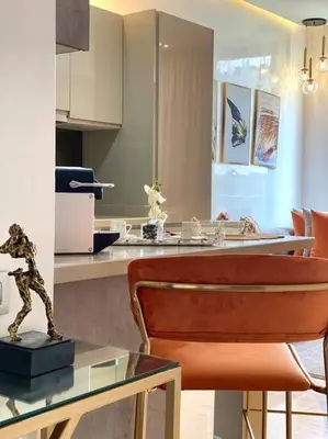 a kitchen with a table with a statue on top of it at La Corniche- Fab Design Ocean - By AppartAli in Casablanca