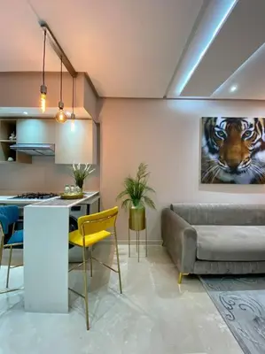 a living room with a couch and a table at Charming Top Floor Bourgogne - By AppartAli in Casablanca