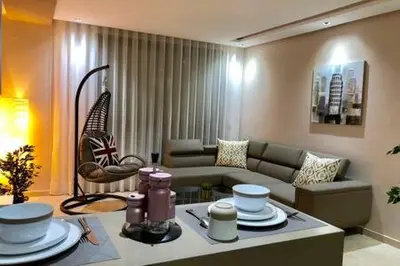 a living room with a couch and a table at Contemporary Top Floor Bourgogne - By AppartAli in Casablanca