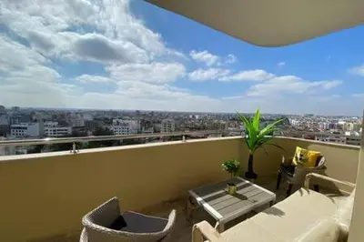 a balcony with a view of a city at Maarif Sunset View - 3 Bedrooms - By AppartAli in Casablanca