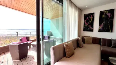 a living room with a couch and a view of the ocean at The view - Marina 2 Beds - By AppartAli in Casablanca