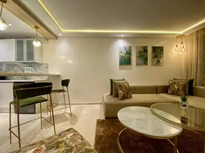 a living room with a couch and a table at Deluxe Princesses Design - By AppartAli in Casablanca
