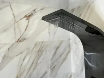 a shower head with water coming out of it at Modern Cosy Studio Anfa in Casablanca