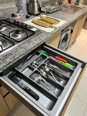 an open drawer in a kitchen with utensils at CHIC & COZY appartement très calme in Casablanca