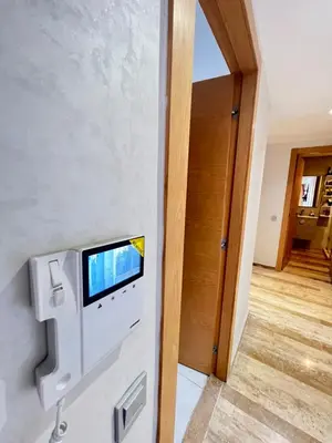 a room with a tv on the wall at CHIC & COZY appartement très calme in Casablanca