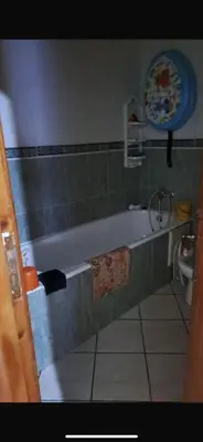 a bathroom with a bath tub and a sink at Mohamedia in Mohammedia