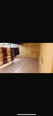 a room with a table and a chair in it at Mohamedia in Mohammedia