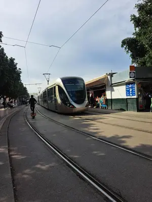 a train on the tracks at a train station at Les Portes de l'Océan avec piscine uniquement l'été in El Harhoura