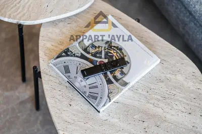 a book sitting on top of a table at Royal Ocean Suite - By Ayla Stay in Casablanca