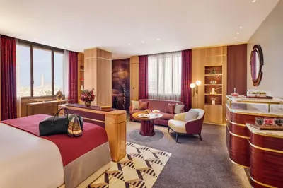 a hotel room with a bed and a living room at Royal Mansour Casablanca in Casablanca