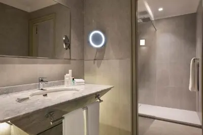 a bathroom with a sink and a shower at Casablanca Marriott Hotel in Casablanca